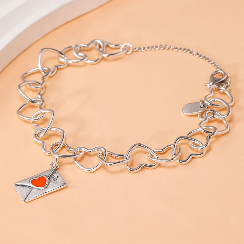 

Genuine 925 sterling silver Connected Hearts Charm Bracelet paired with Love Letter Pendant