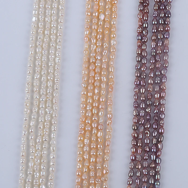 Precio al por mayor 2,8-3,2mm Natural blanco rosa púrpura forma de arroz perlas de agua dulce hebra para joyería al por mayor
