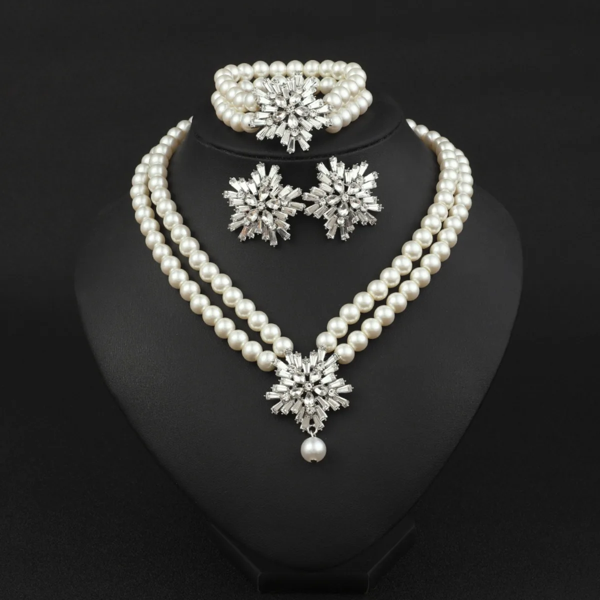 

Triple Strand Pearl Jewelry Set with Crystal Snowflake Pendant Necklace Earrings and Bracelet Bridal Statement
