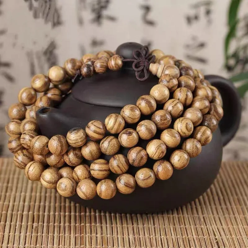 

Vietnamese agarwood 108-bead men's bracelet made of , nanmu, yellow rosewood, and golden silk incense wood