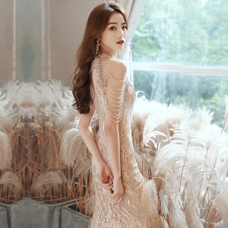 The golden banquet style host's fishtail dress is a new