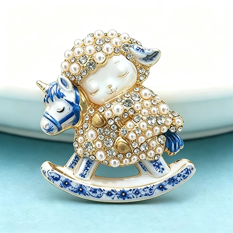 Wuli&baby Lovely Rocking Horse Sheep Brooches Women Blue and White Porcelain Pearl Lamb Animal Party Brooch Pin New Year Gifts