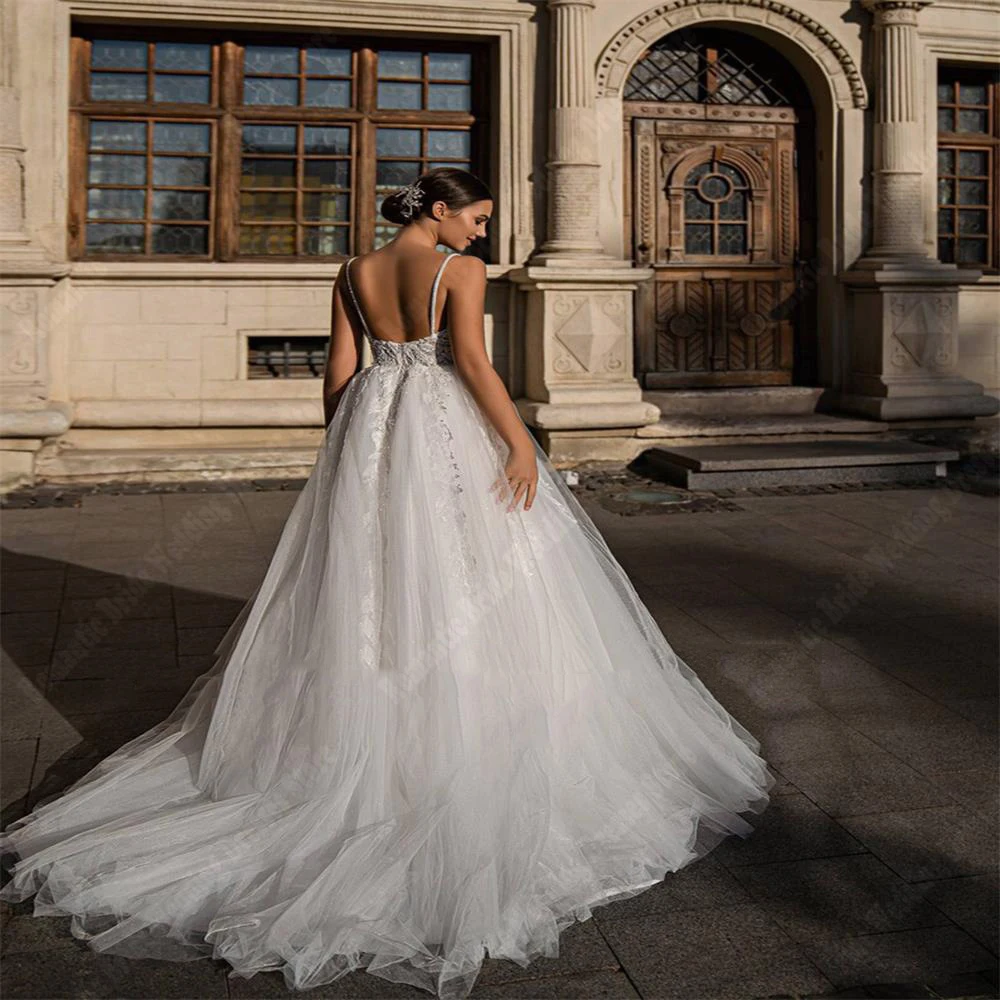 Abiti da sposa Sexy di colore Lvory per le donne 2024 nuovi abiti da sposa senza maniche con scollo A V profondo ricamo con paillettes luminose una linea Robe