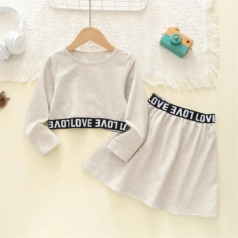 

Girl‘s Clothes Set Spring and Autumn Long Sleeve Crew-neck Waist Letter Print Long Sleeve + Skirt Suit Kids Clothes
