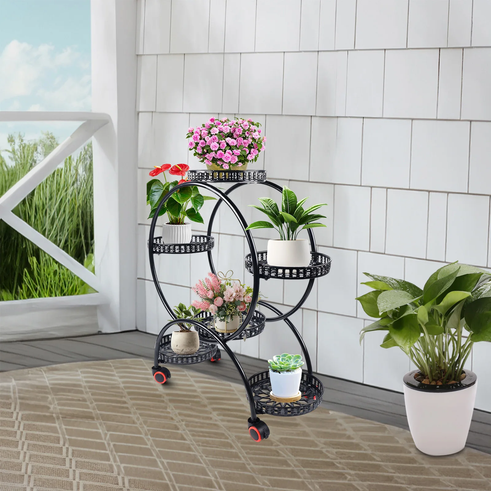 

The black plant stand complements a variety of flowers and potted plants, suitable for both indoor and outdoor settings.