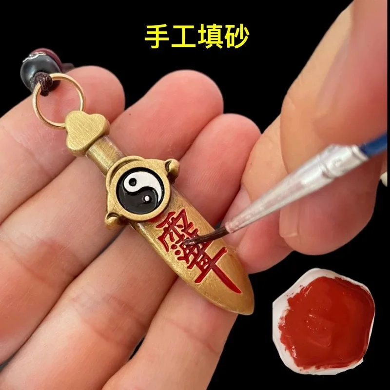 Taoist Brass Seven-Star Sword and Eight Trigrams Pendant, a ritual object, a portable keychain charm, handcrafted with cinnabar