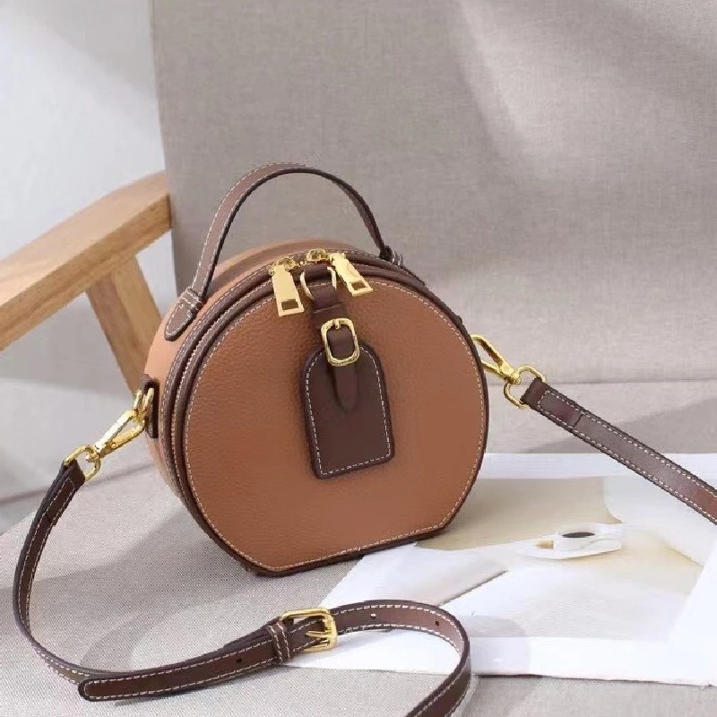 

Genuine Leather Versatile High-capacity Top Layer Cowhide Contrast Litchi Pattern Handheld Shoulder Round Cake Women's Bag