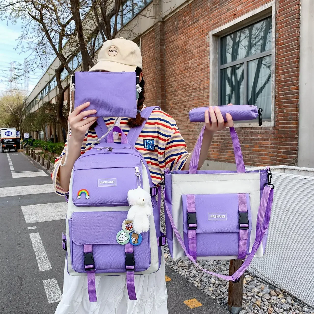 Conjunto de cuatro piezas de mochila de estudiante para mujer en versión coreana Campus de escuela secundaria de lona informal con gran capacidad