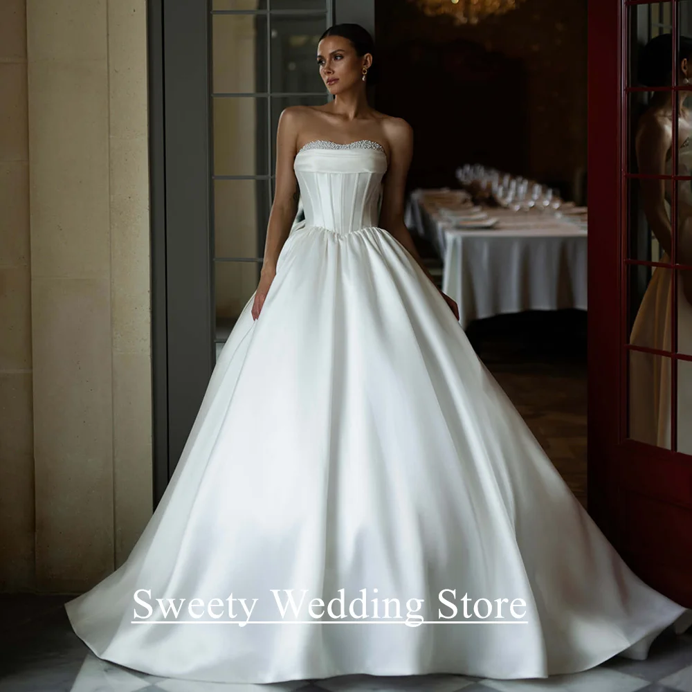 Ballkleid-Hochzeitskleid, maßgeschneidert, herzförmig, ärmellos, Perlen, Falten, Korsett, Brautkleid für die Braut, Robe De Mariee, Sweep-Zug