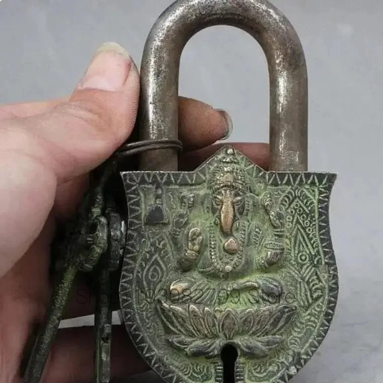 

Ancient Tibetan bronze Buddha, Ganapati Ganesh, Buddha, 2 keys, door lock