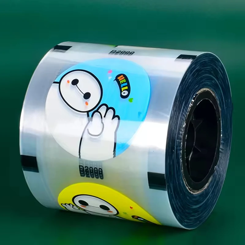 Calibro 90/95 Figura di cartone animato Logo stampato Pellicola sigillante per tazze Tè al latte Tazza di plastica Pellicola sigillante per latte di soia Un rotolo di rilegatura