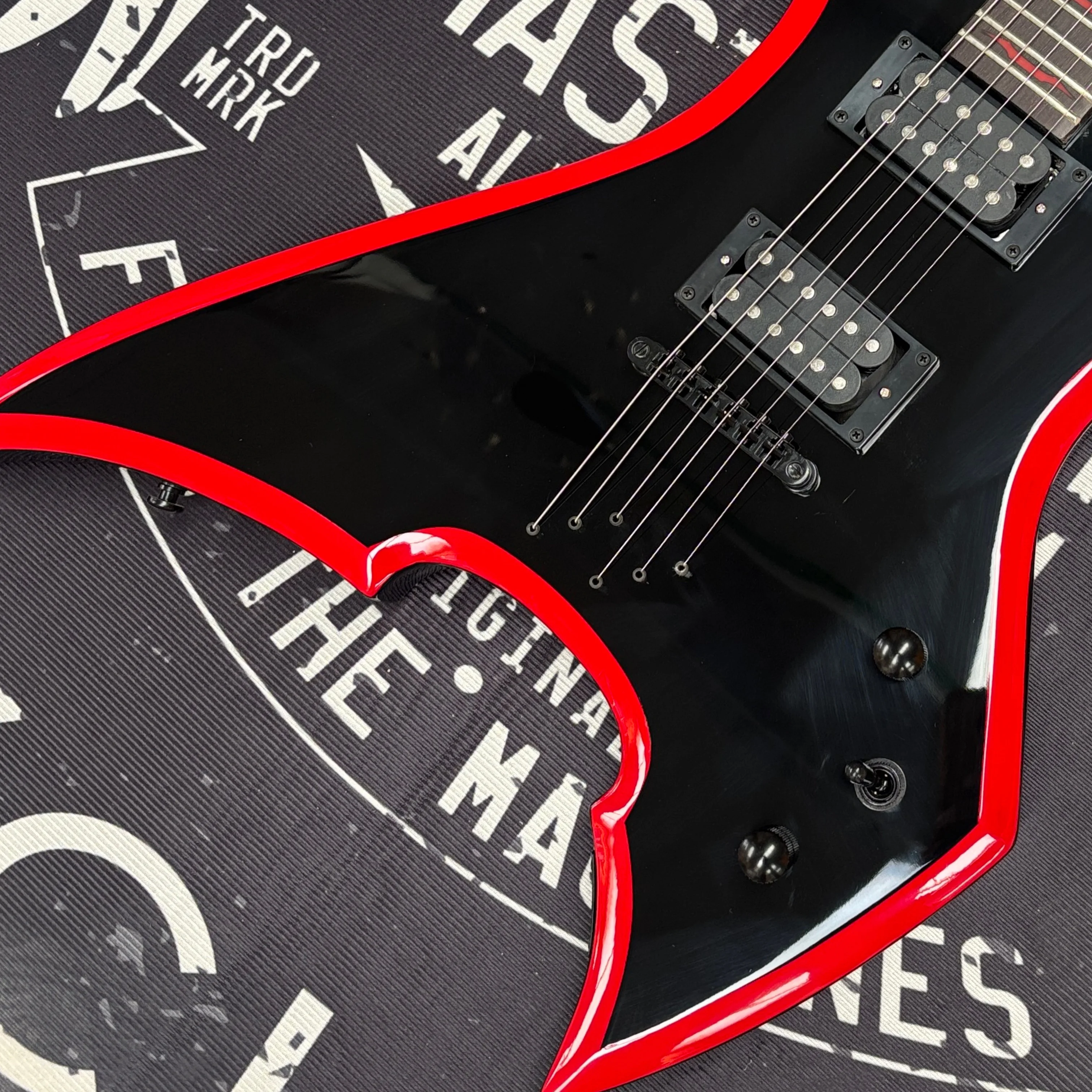 6-string electric guitar with black and red color contrast design,dual knobs for tone control guitars—stylish beginner guitarra