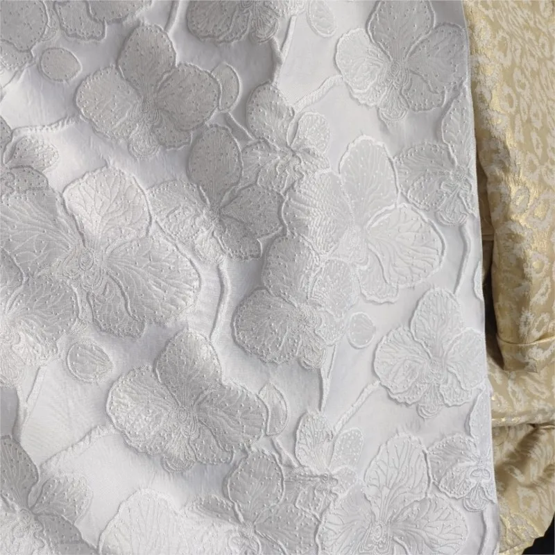 Embossed dark pattern white blue jacquard fabric with a textured for women's dress and evening wear