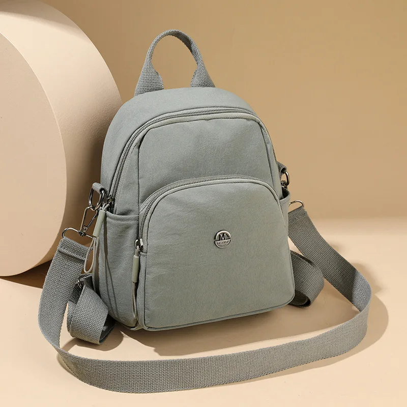 

Solid Color Nylon Backpack Lightweight Travel School Bag Fashion Daypack for Work Small Travel Bag Multi-functional Shoulder Bag