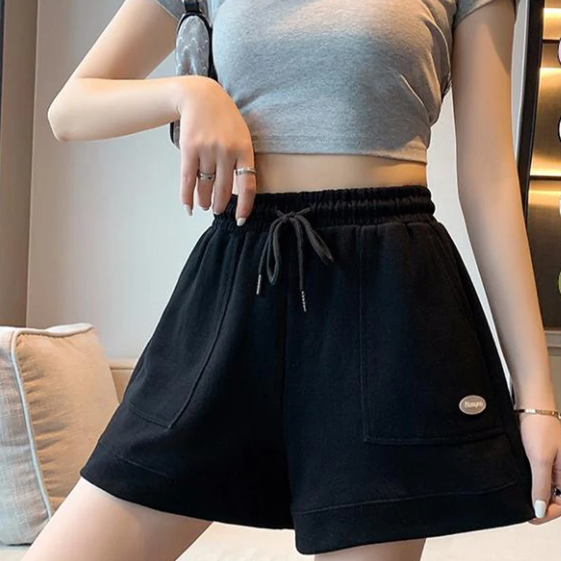 

Women's Wide-Form Sports Shorts In Fish Leather Fabric With Elastic Waistband And Drawstring Design For Active Fashion