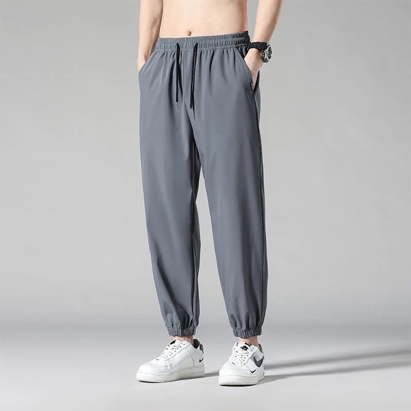 

Мужские спортивные брюки из ледяного шелка: тонкие, быстросохнущие, для бега и повседневной носки, летние, молодежные, для активного отдыха, из полиэфирного волокна