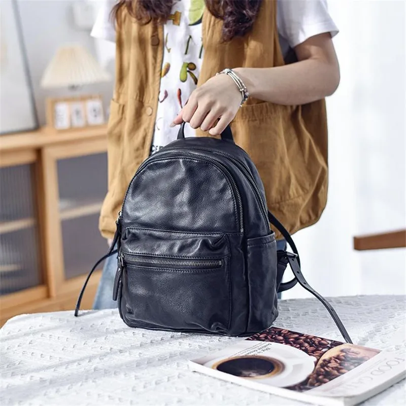 

PNDME weekend daily party first layer cowhide women's black backpack simple designer handmade luxury genuine leather bookbag