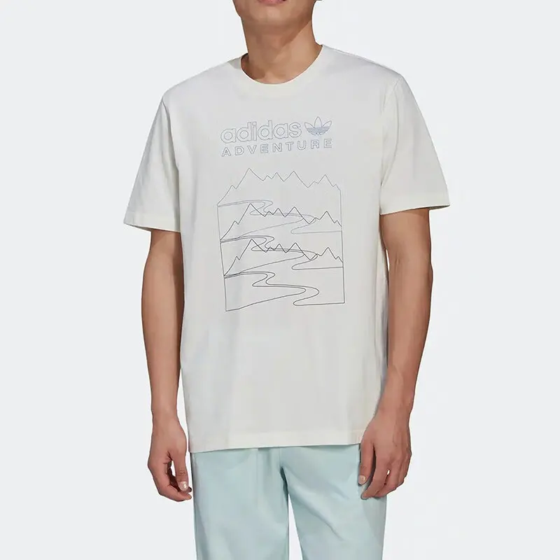 

Adidas Originals Men's Off White Short Sleeve T Shirt with "adidas ADVENTURE" Text and Mountain Pattern for Casual and Spo