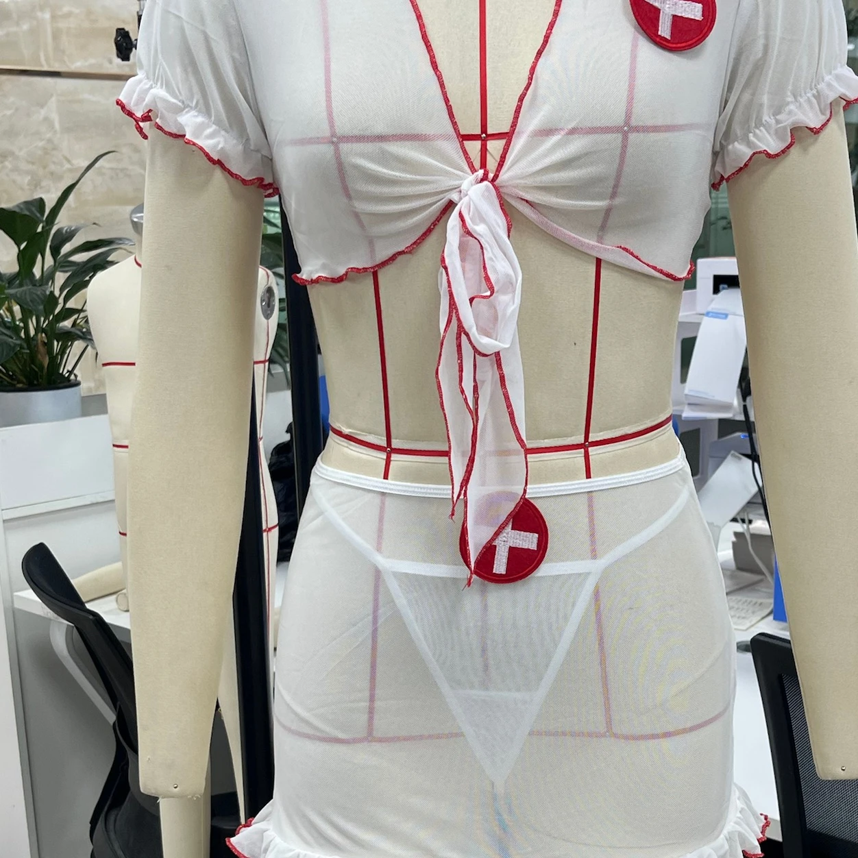 

Women's Naughty Nurse Lingerie Sets Mesh Short Sleeve Crop Tops with Ruffled Skirt and Thong 3Pcs Sleepwear
