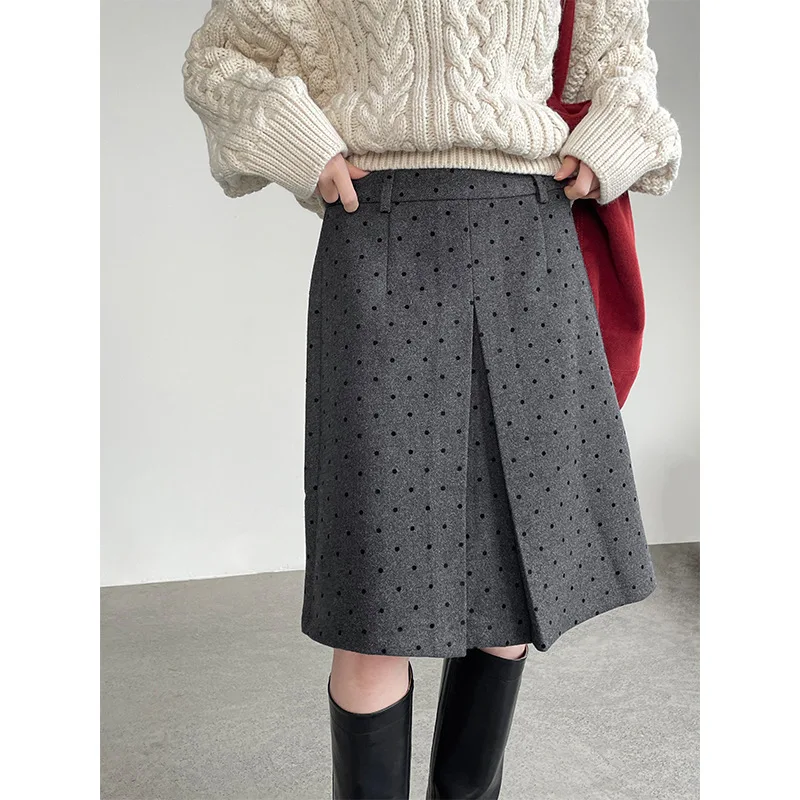Jesienno-zimowa koreańska spódnica wełniana w stylu retro w grochy, pogrubiona, do połowy łydki, podkreślająca temperament.