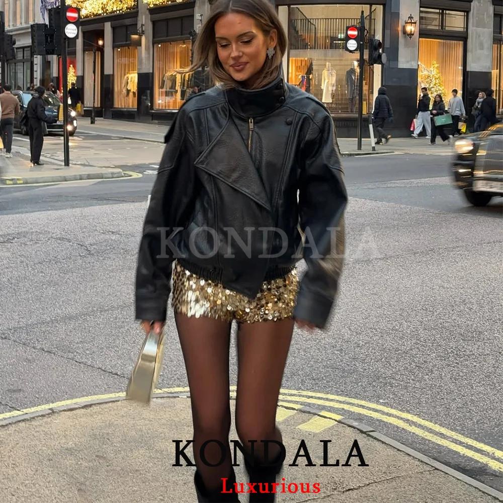 Back view of the KONDALA jacket, showing the clean lines and oversized silhouette.