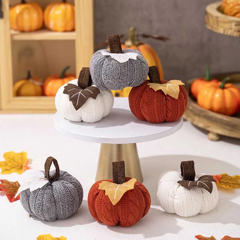 

Autumn harvest pumpkin figurines set of three with orange gray and white colors for seasonal home decoration and festive parties