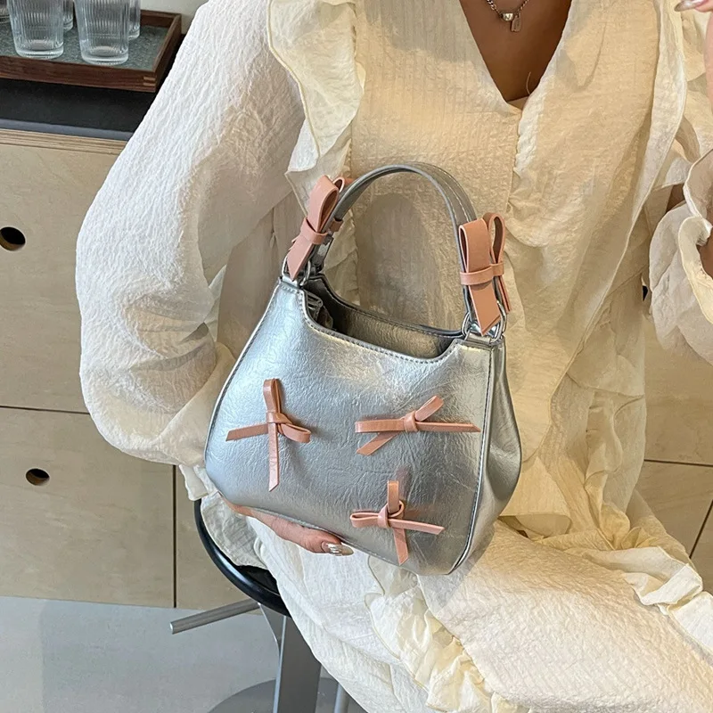 Niche design high-grade portable bucket bag female 2024 spring new trend line bow single shoulder cross-body bag