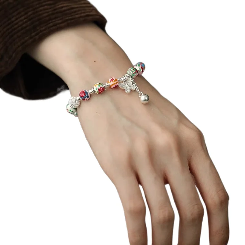 

Pure silver 999 twelve flower god enamel hollow bead butterfly bracelet female ethnic style versatile bracelet