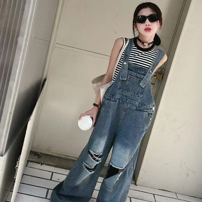 

Elegant Children Jeans Jumpsuit with Broken Holes For Girls Fashion Overalls Streetwear Kids Denim Suspenders Pants With Strap
