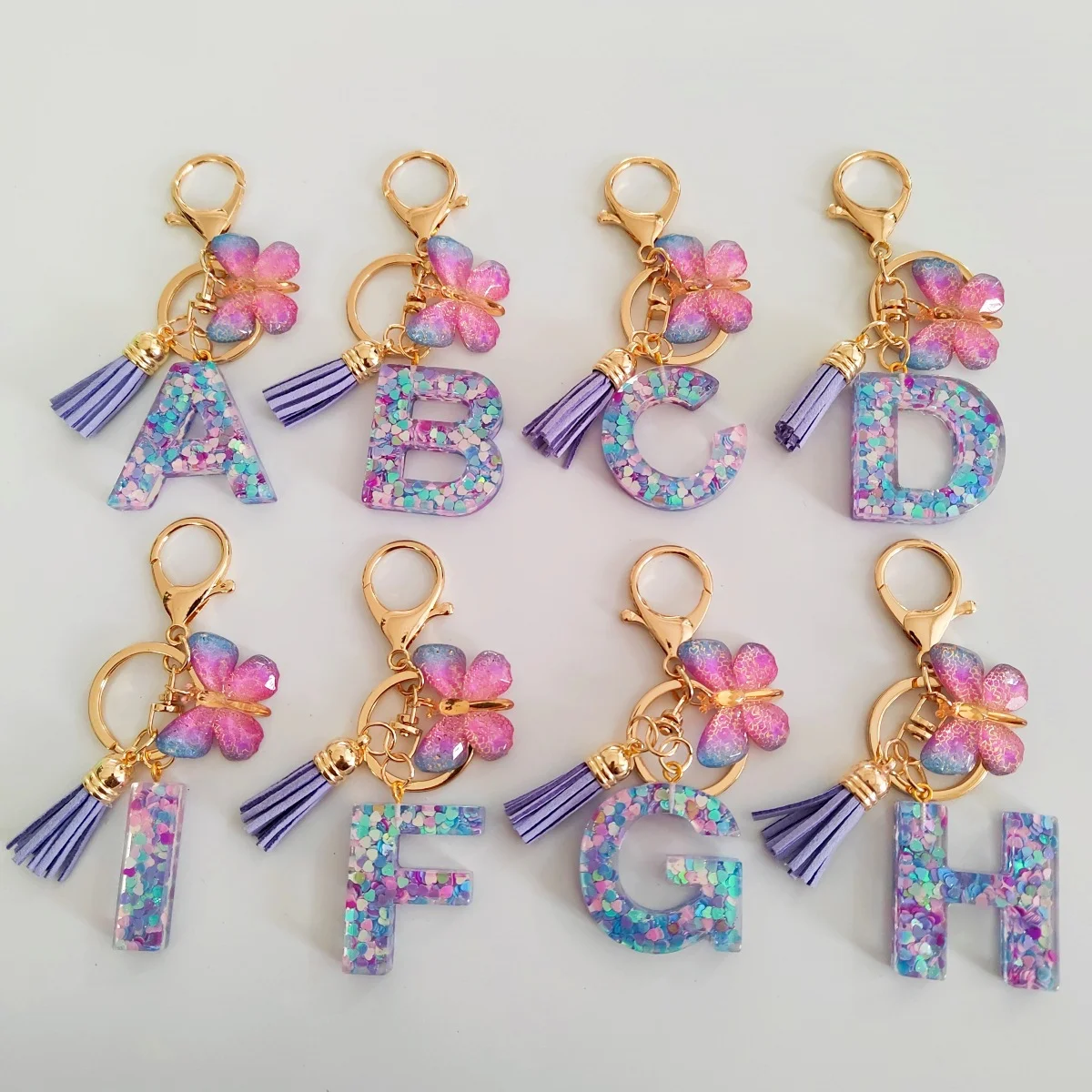 LLavero con inicial de flecos de mariposa a la moda, mezcla de pegamento en forma de gota, llavero con letras de A-Z26, bonito bolso de estudiante para mujer, accesorio de regalo