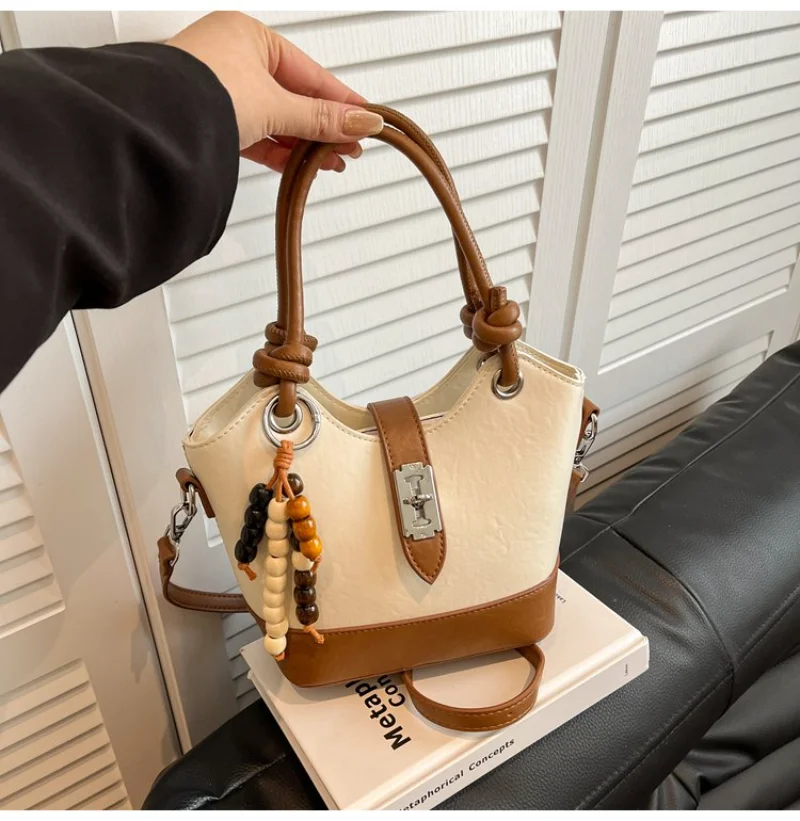 

Women's Two-Tone Leather Bucket Handbag with Turn Lock & Wood, for Daily Office, Streetwear, Weekend Travel, Shopping & Errands