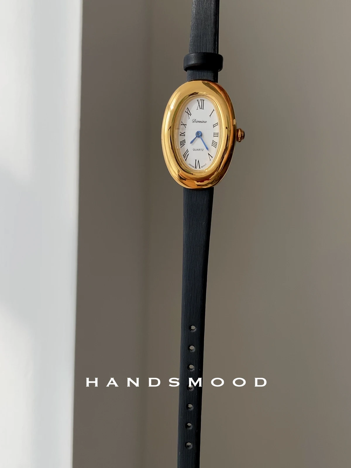 

An oval black and gold dial quartz watchexquisitestylishand sophisticated, perfect as a gift for women. A luxury women's watch.