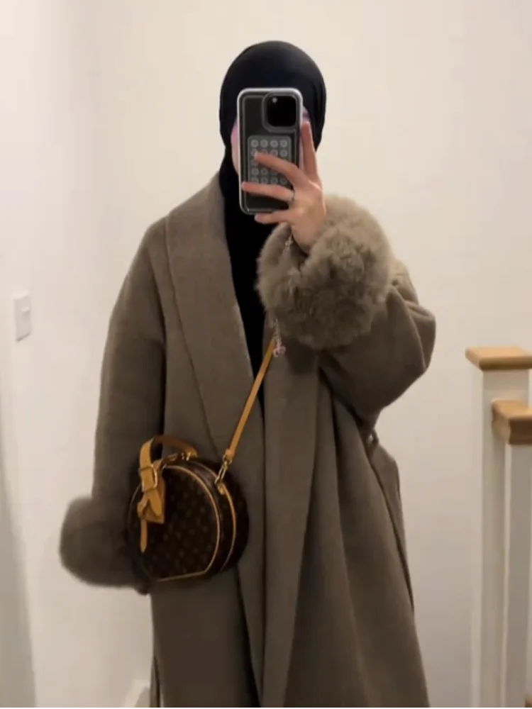 Abrigos de piel sintética con solapa esponjosa marrón a la moda con cinturón para mujer, Chaqueta larga gruesa y cálida para invierno, ropa de abrigo elegante de calle para mujer 2025