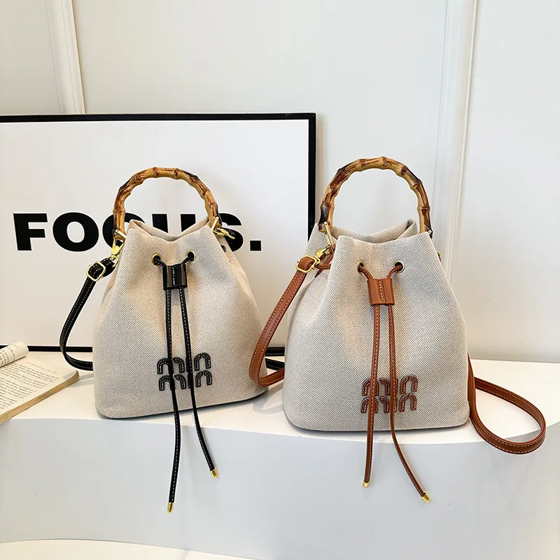 

2026 Trendy Canvas Bucket Bag, Vintage Drawstring Top Handle Tote, Women‘s Chic Shoulder Bag for Daily Commute & Travel