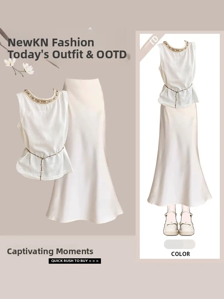 

Комплект из двух предметов: топ с открытыми плечами и жилет с дизайнерскими бусинами, а также юбка с индивидуальным кроем для молодых женщин.