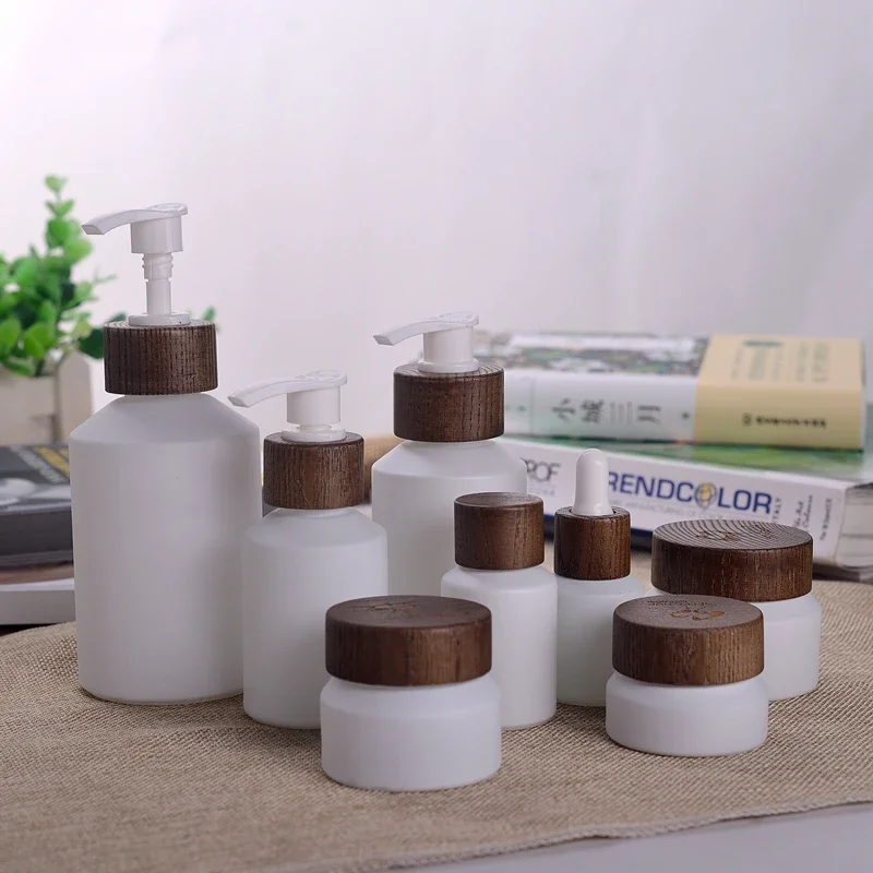 

empty cosmetic containers porcelain white glass jars opal porcelain face cream glass jar with dark wood lid，skin care tools