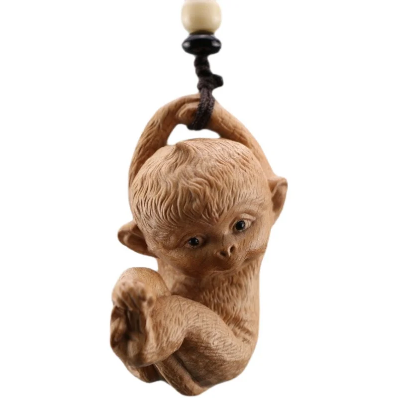 

Crafted Monkey Figurine Pendant, Solid Wood Artistry, Enchanting Car Bag Accessory, Unique Handle Decoration