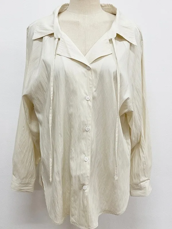 シックな春アンチエイジング長袖ルーズフィット女性のシャツリボンデザインピュアカラー多用途シングルボタンターンダウンカラー