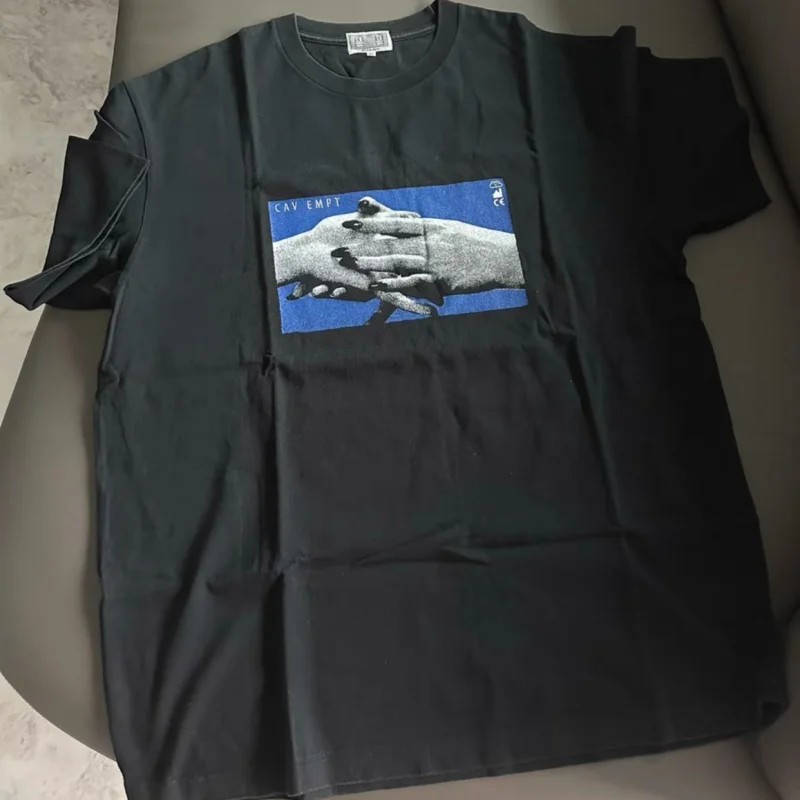 

Men Women Summer Street Outfit CAVEMPT Tshirts Round Neck Casual Top Abstract Pixel Hand Holding Pattern Short Sleeve Black Tees