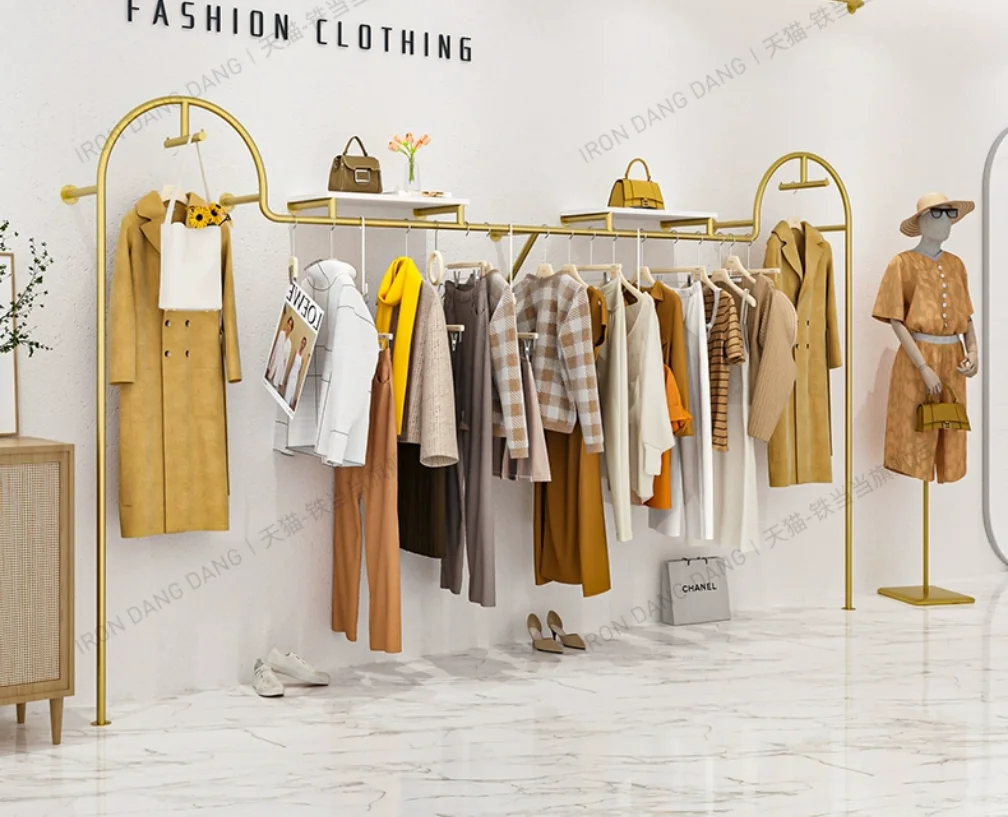 

Clothing store hanging clothes rack on the wall, wrought iron gold clothing display rack, women's clothing store shelf display r