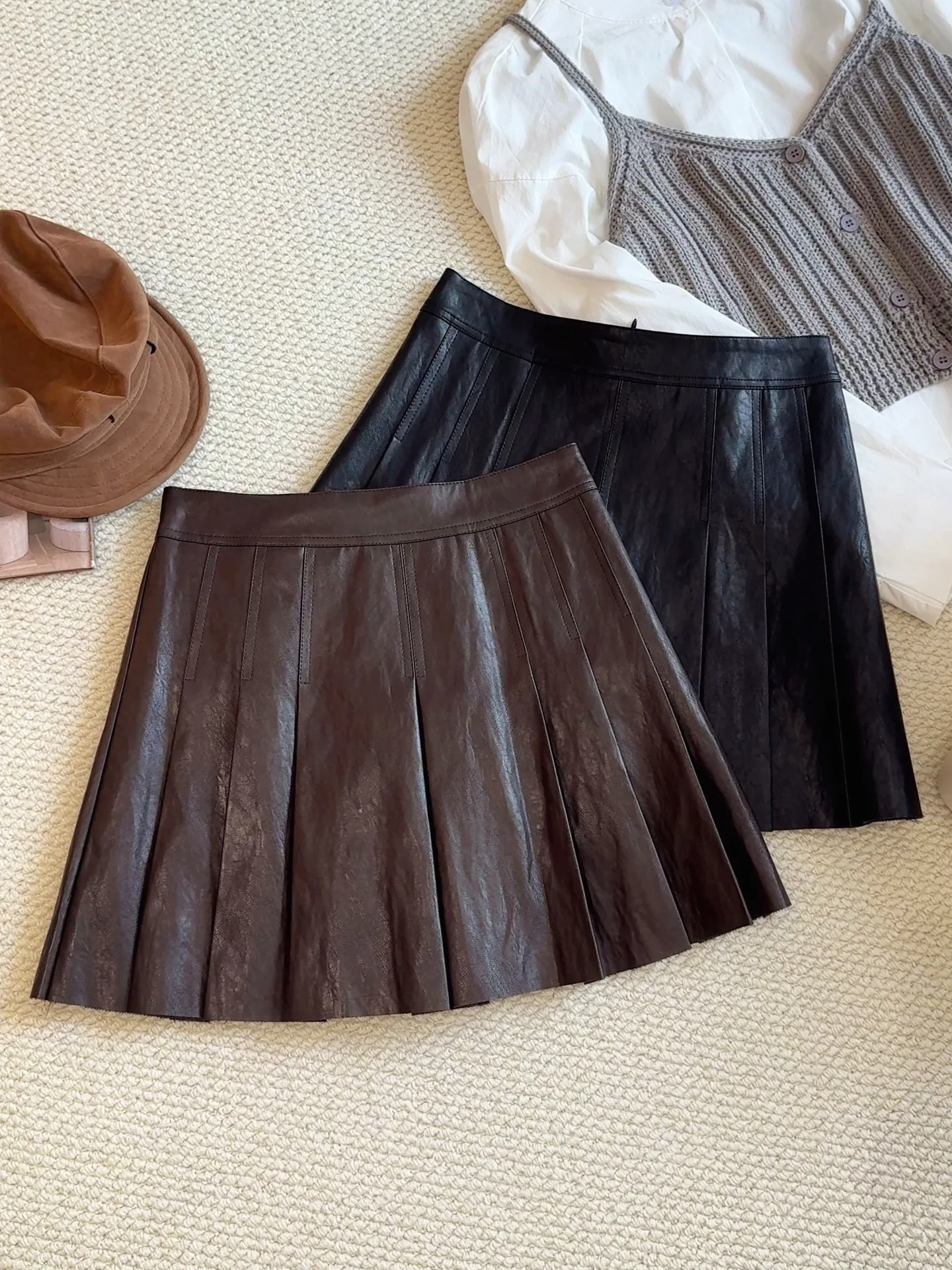 

PU midi skirt women's new 2025 autumn and winter high waist A-line small leather skirt versatile pleated skirt