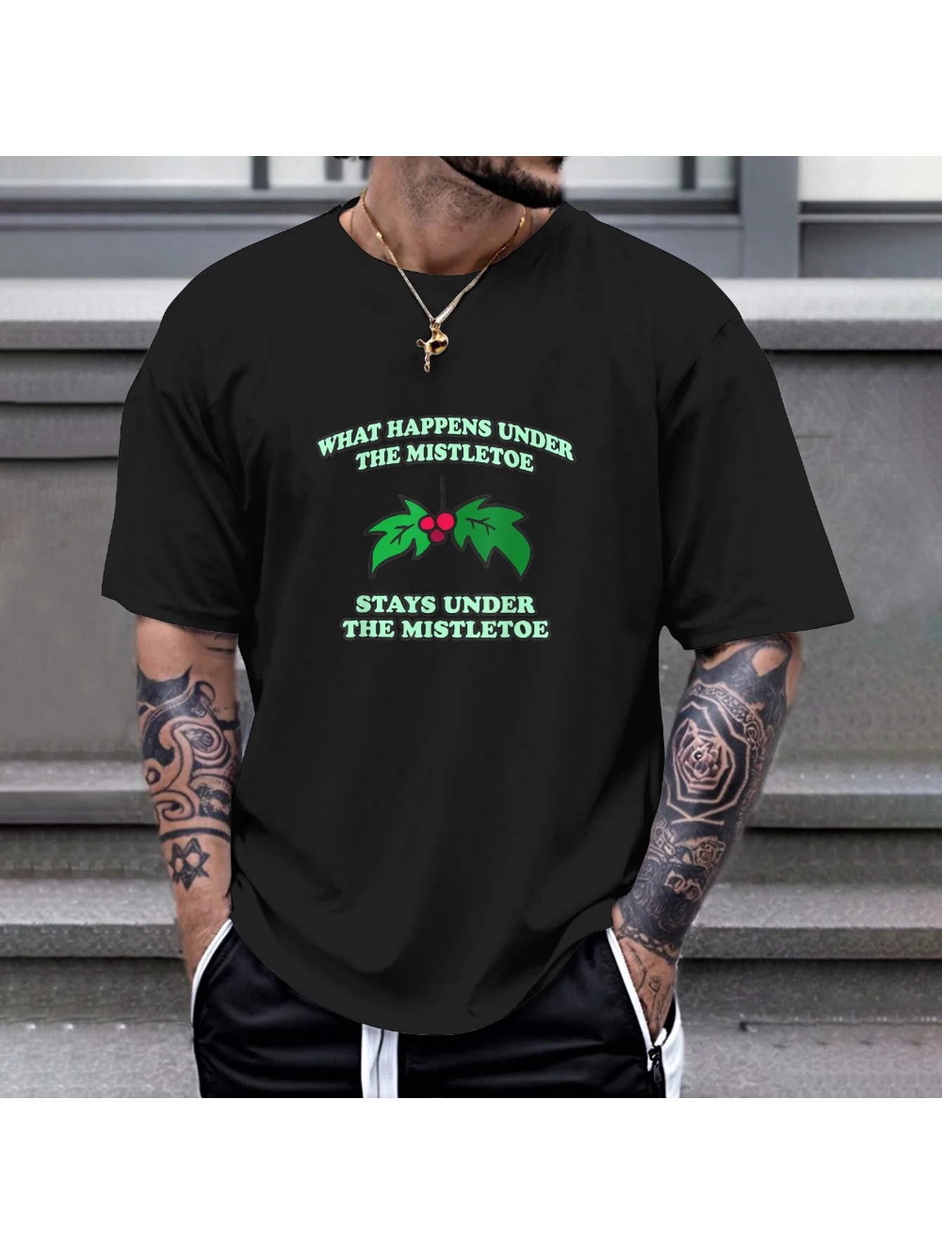 

Christmas "What Happens Under Mistletoe" T-Shirt - 180gsm Cotton, Humor Tee