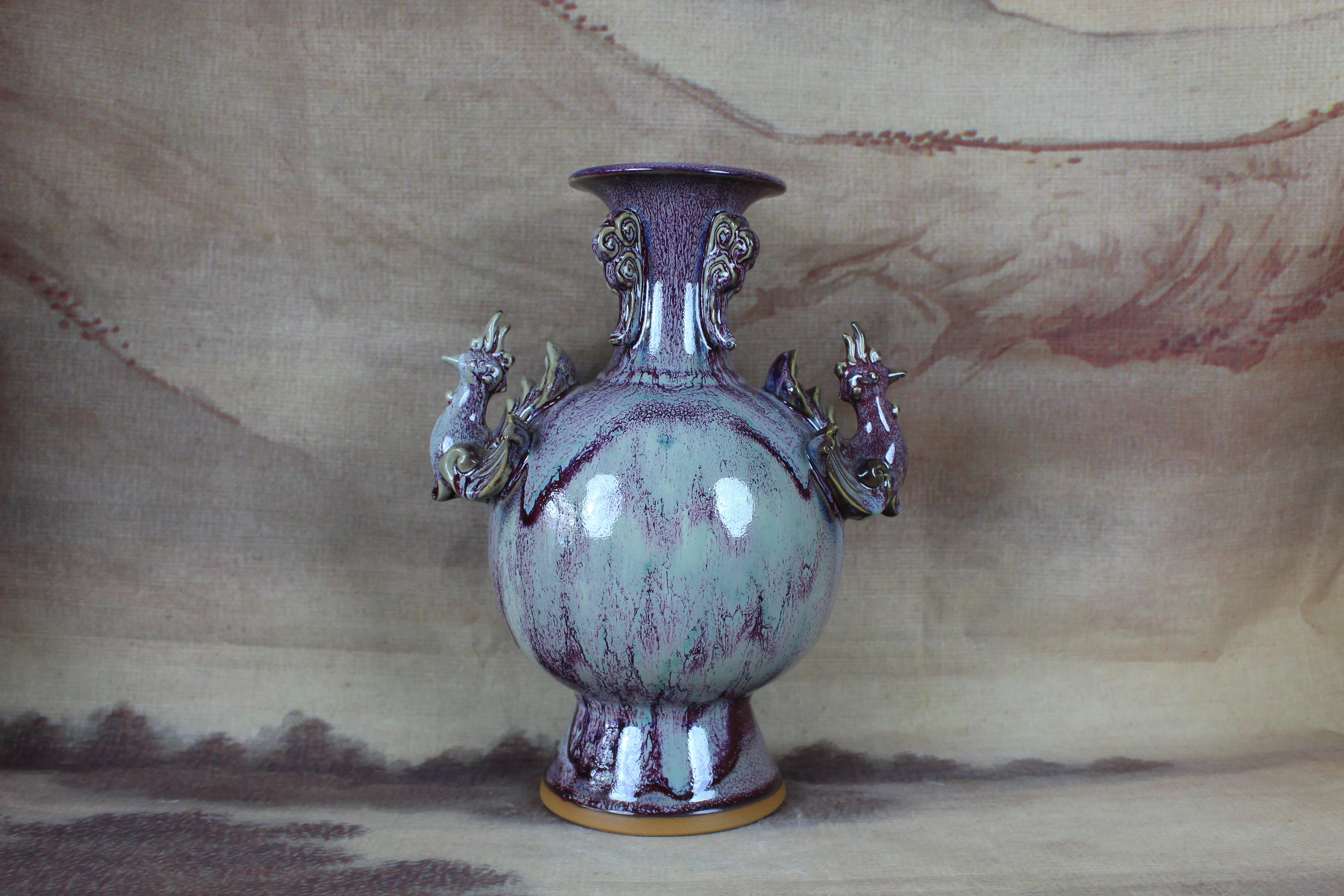 Jun Old porcelain with glaze of changing color and carving of phoenix bottle, collection decoration.