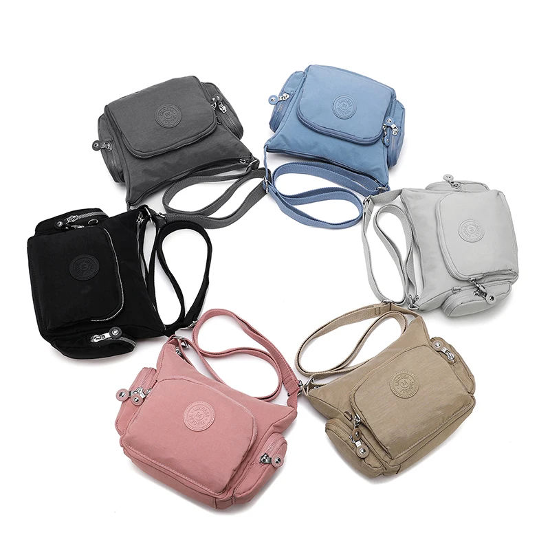 

2025 portable waterproof nylon cloth shoulder bag, simple solid color outdoor crossbody bag, commuting lightweight travel bag