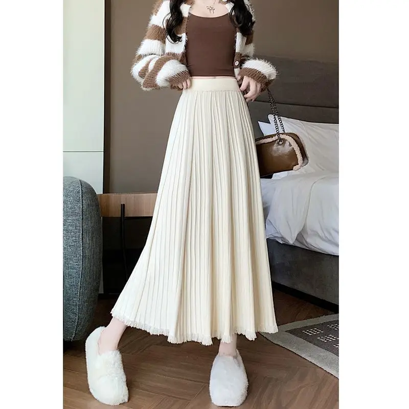 

Корейская модная вязаная юбка с кисточками для женщин, новинка 2023 года, осенняя ленивая модная универсальная нежная темпераментная юбка трапециевидной формы с высокой талией