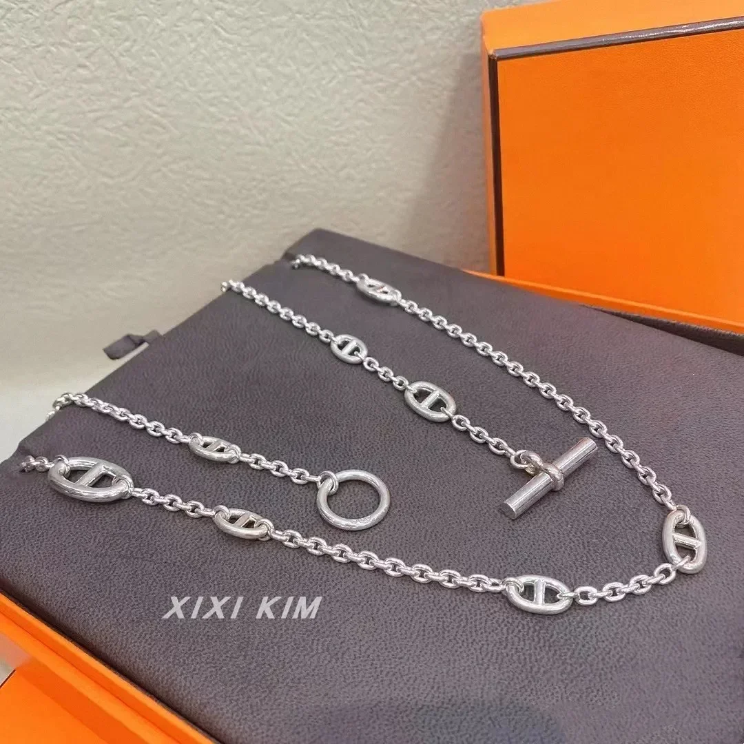 A variety of ways to wear heavy industry metal pig nose long sweater chain women's bag necklace stacked wearing European