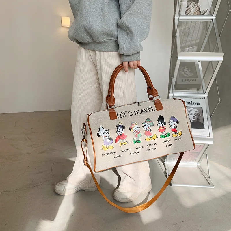 MINISO Mickey Mouse New Canvas Travel Bag Portable Storage Bag Cartoon Travel Bag Ladies Large Capacity Shoulder Bag Luxury Bag