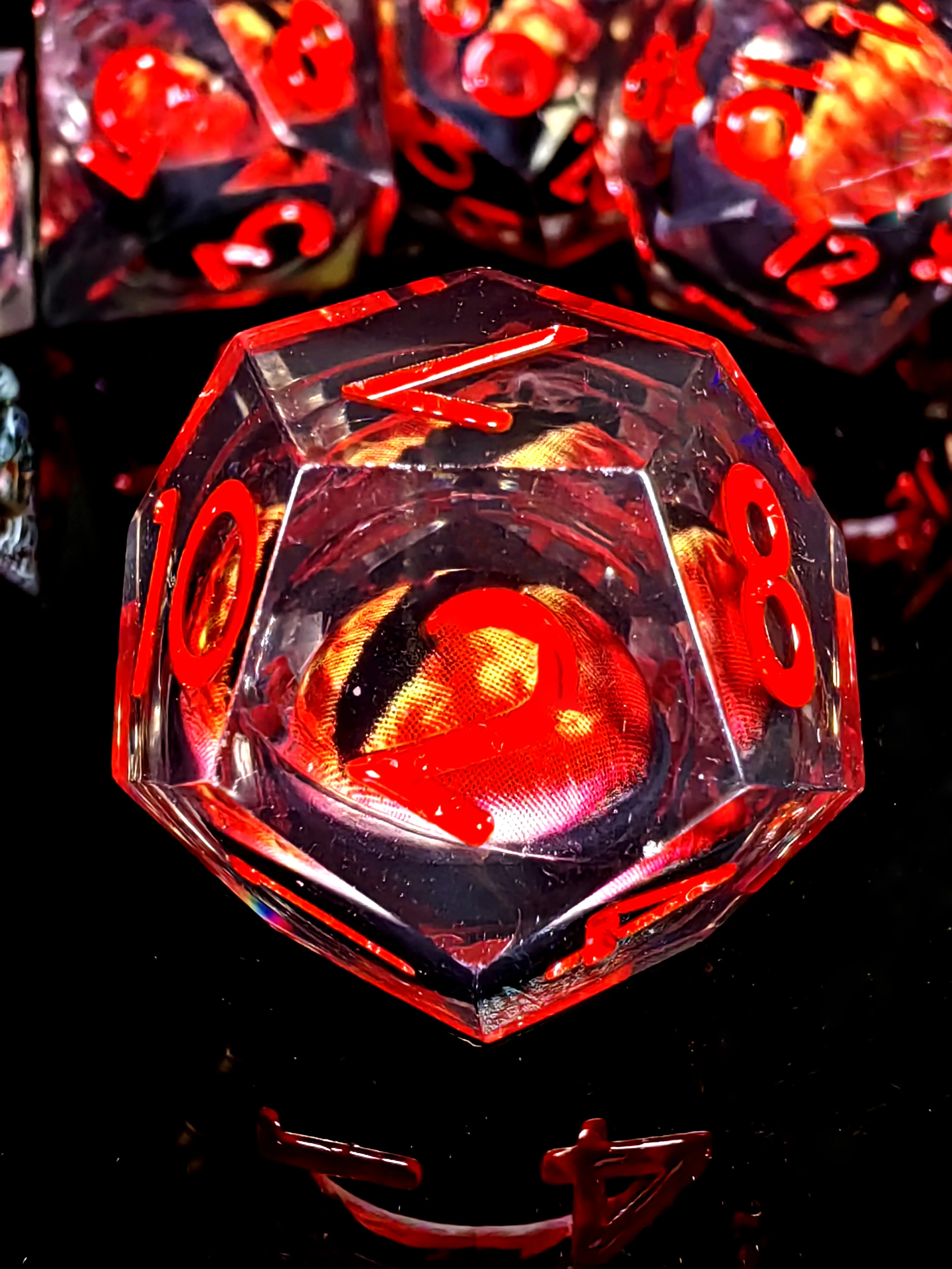 DnD Dice Set - 7-Piece Resin Dice with Spinning Dragon Eye Core, Transparent Base Red Lettering for Tabletop RPG and Board Games