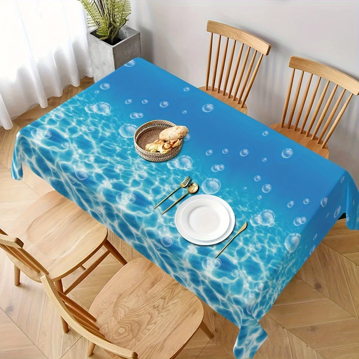 A tropical blue sea wave seawater flowing wipeable tablecloth for kitchen use as a dining table decoration.