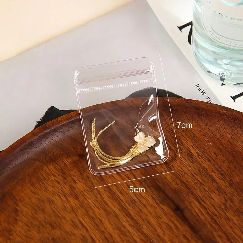 100 Stück kleine transparente PVC-Schmuckaufbewahrungsbeutel, kleine Zubehör- und Perlenverpackung, Anti-Oxidationsbeutel, selbstverschließende Plastiktüten – Detail 2
